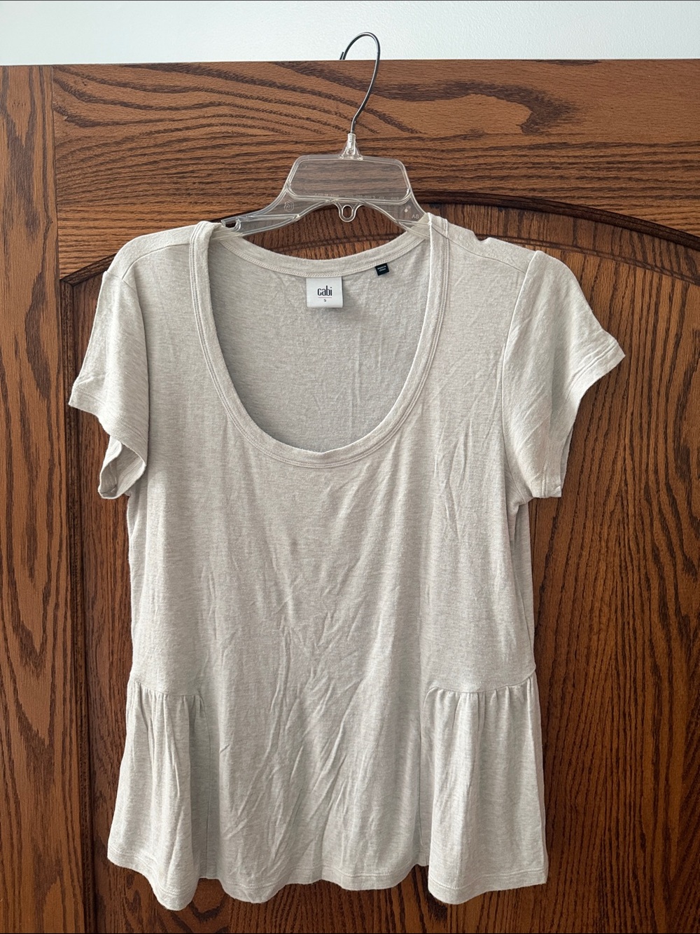CAbi Cream Scoop Neck Short Sleeve Peplum Top